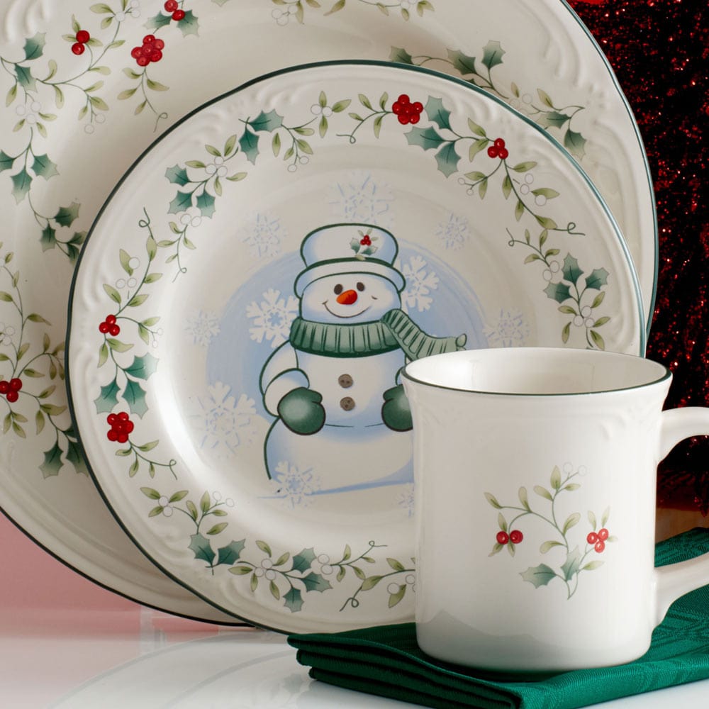 Snowman salad plates set with holiday dishes and ornaments