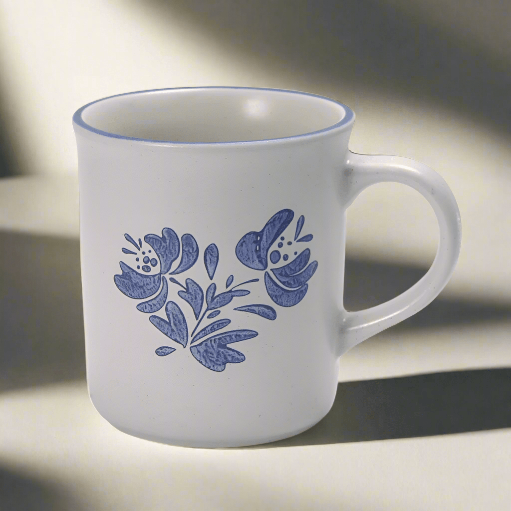 Yorktowne stoneware coffee mug with hot coffee on a table