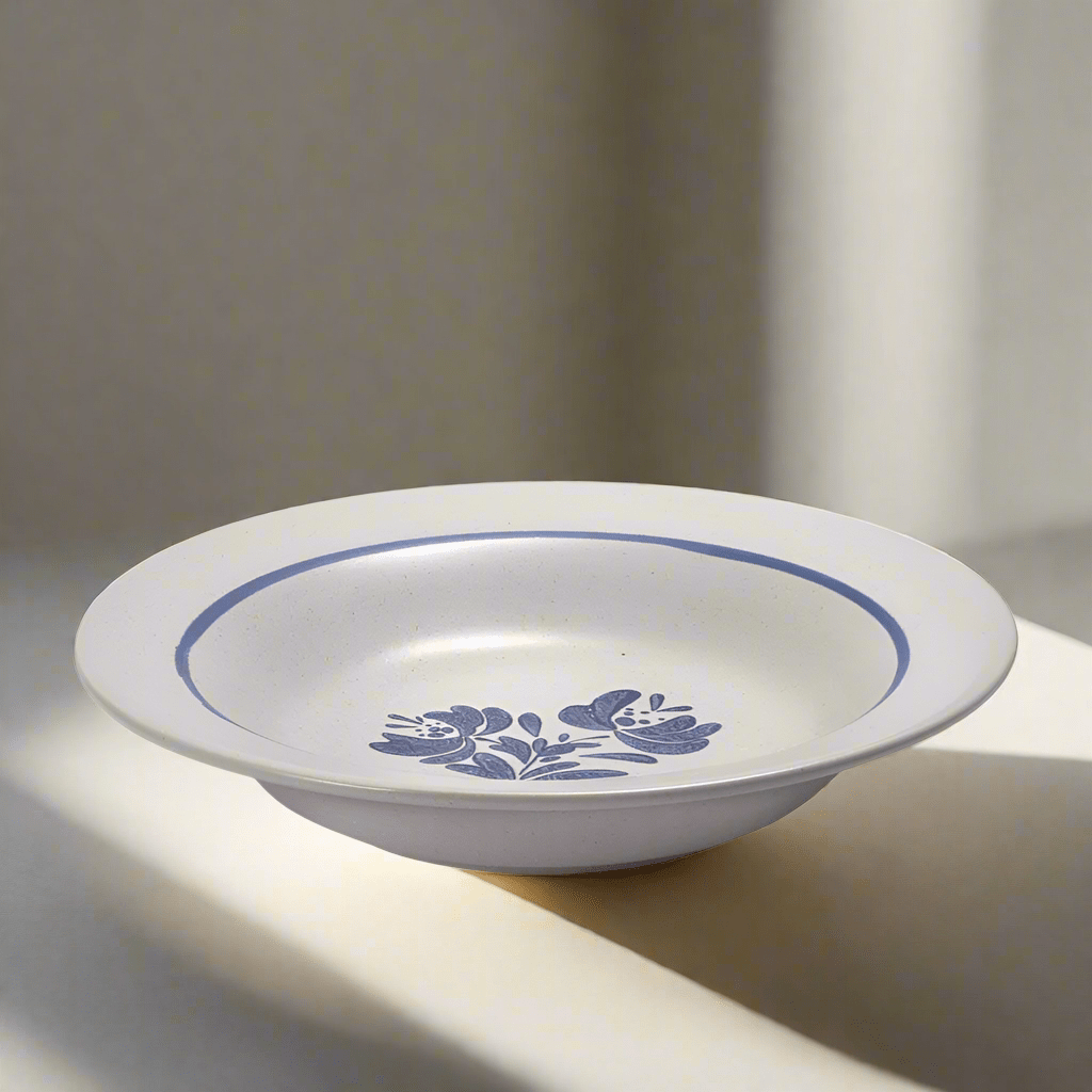 Close-up of the 8-inch stoneware rim soup bowl with soup inside, showcasing its wide rim design
