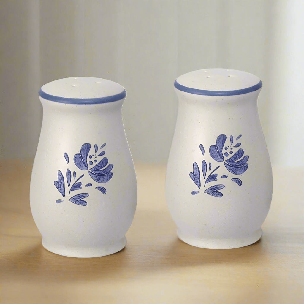 Yorktowne salt and pepper shakers on a dining table, showcasing their elegant design.