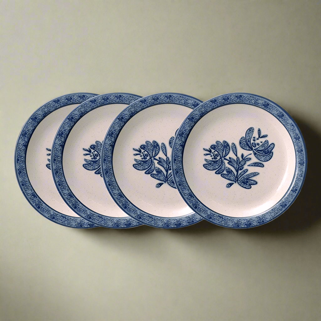 Close-up view of a durable outdoor melamine salad plate set on a picnic table.
