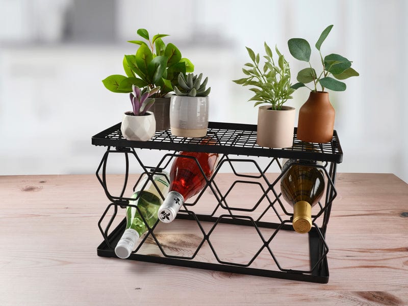 Iron wine rack for 8 bottles displayed on a home bar countertop.