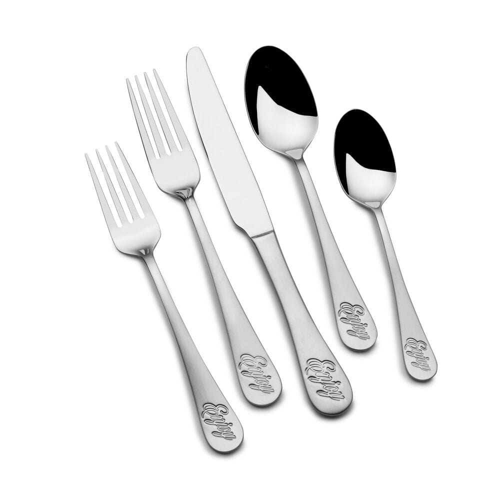 Set of stainless steel dinner utensils arranged for family meal