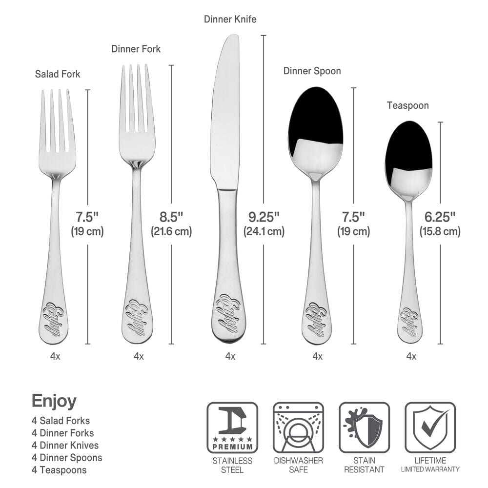 Close-up of whimsical flatware handles with Enjoy inscription on dinner table