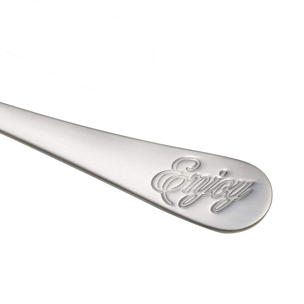 Set of stainless steel dinner utensils arranged for family meal