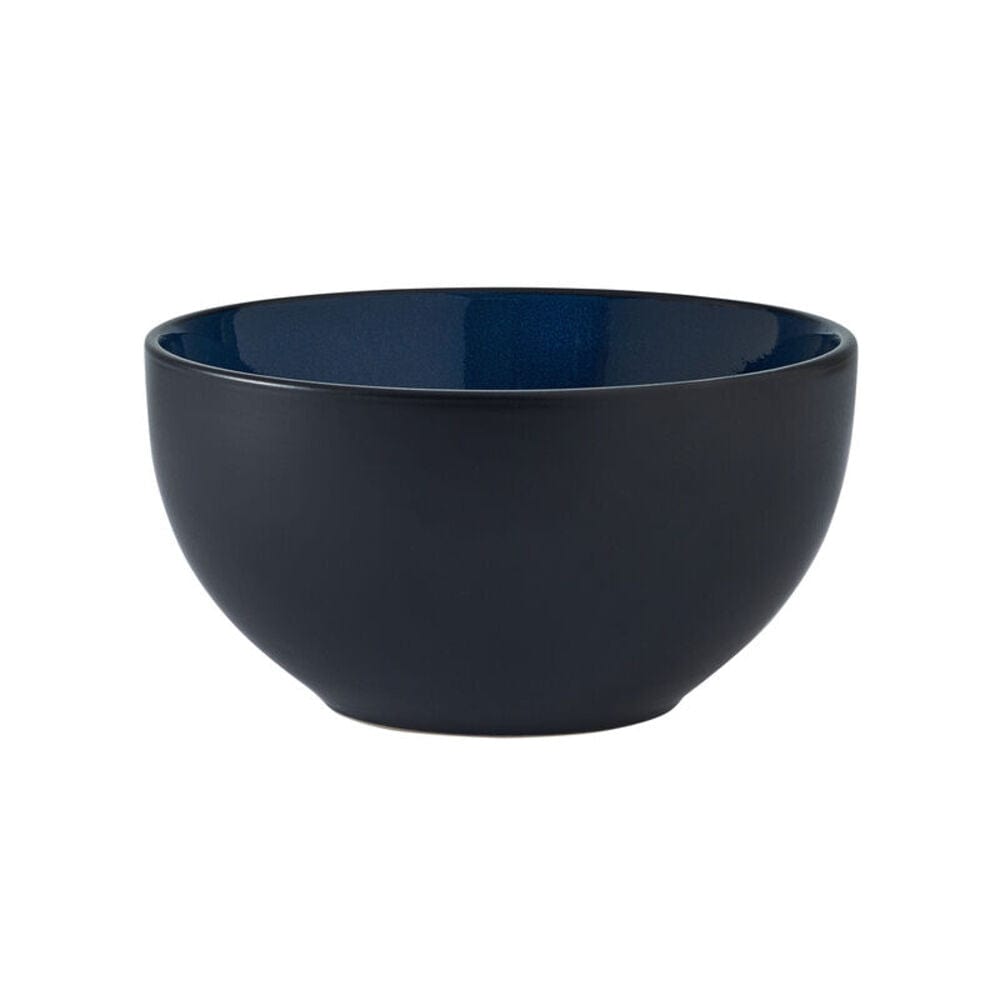 Close-up of the textured, handcrafted reactive glaze on stoneware bowls