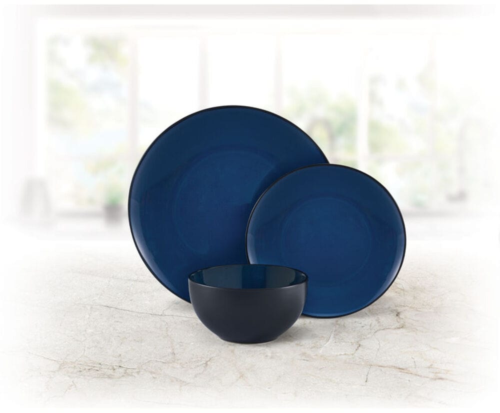 Stacked colorful stoneware dishes with reactive glaze finish