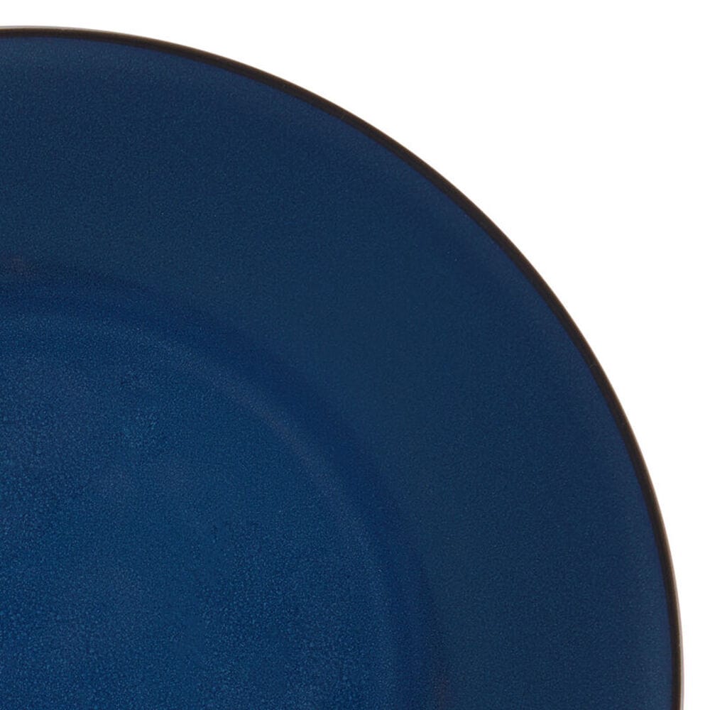 Close-up of the textured, handcrafted reactive glaze on stoneware bowls