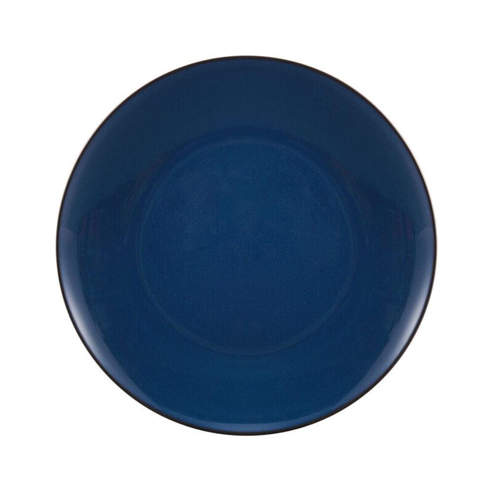 Stacked colorful stoneware dishes with reactive glaze finish