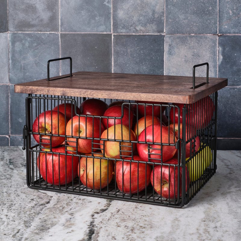 Nesting storage baskets with mango wood lids stacked in a modern living room