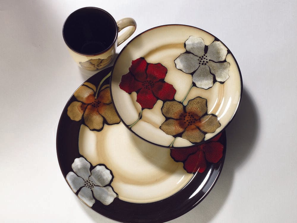Close-up of reactive glaze dinnerware set with floral design