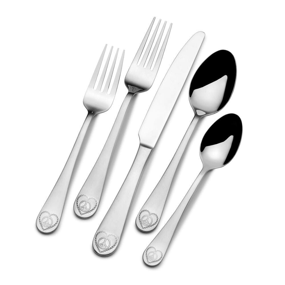 Flatware set for 4 people, featuring dinner knives, forks, spoons, and salad forks on a table