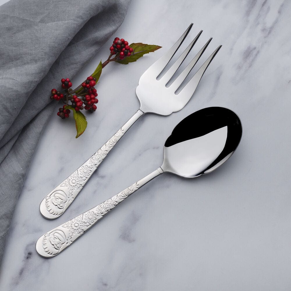 Santa themed kitchenware for holiday parties, featuring a festive serving spoon and fork on a holiday table
