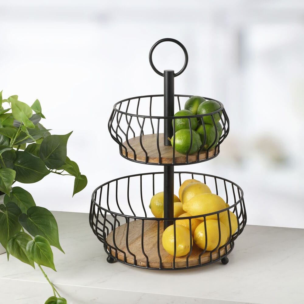Savannah 2-Tier Kitchen Storage Basket with fresh fruits on a countertop.