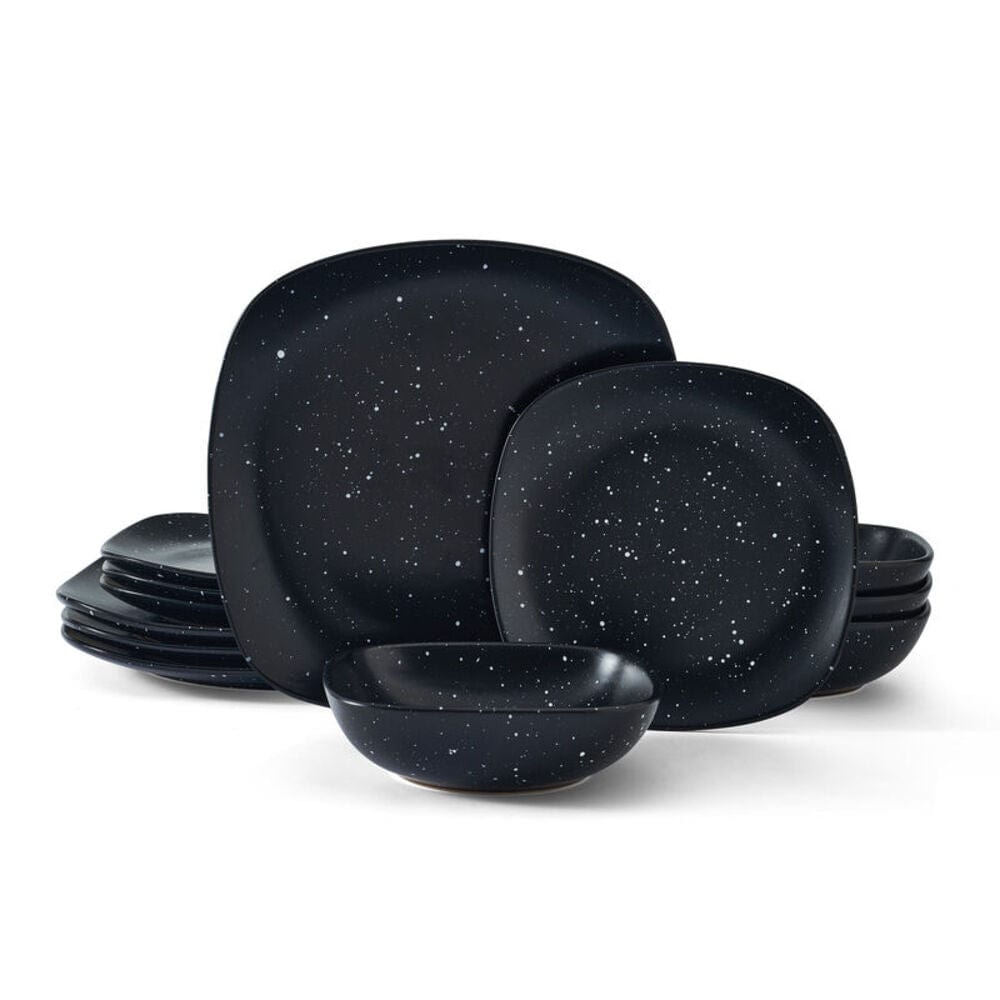Family enjoying meal with modern black dinnerware set for 4