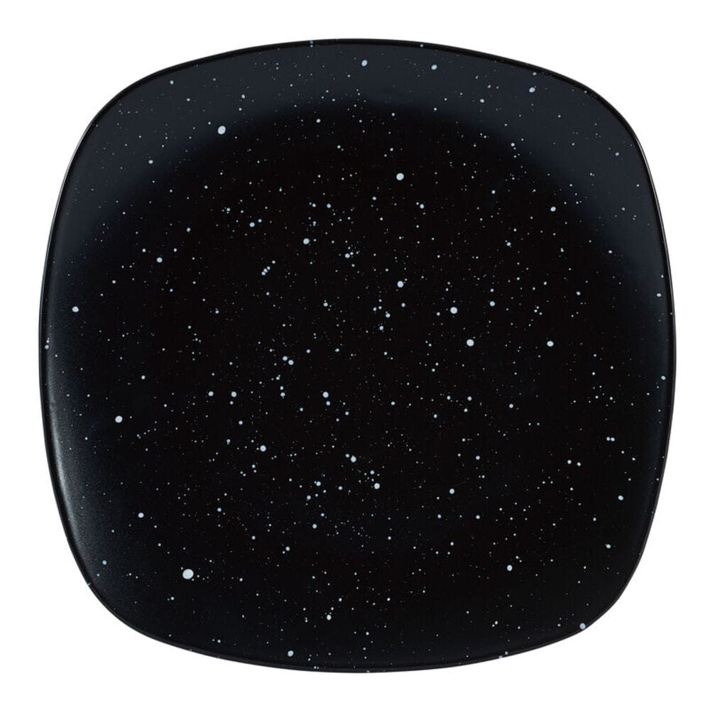 Close-up of galaxy-themed black square dinner plate with speckled glaze