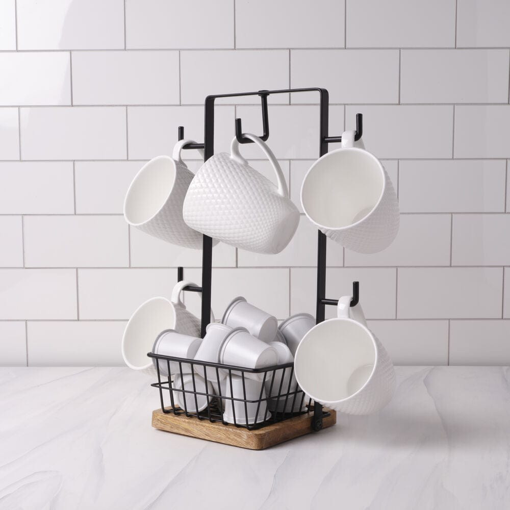 Close-up of mug tree with hooks holding coffee mugs