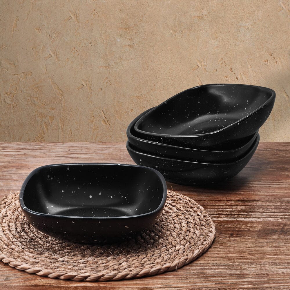 Cosmic Black Square Pasta Bowl set, elegantly displayed on a dinner table.