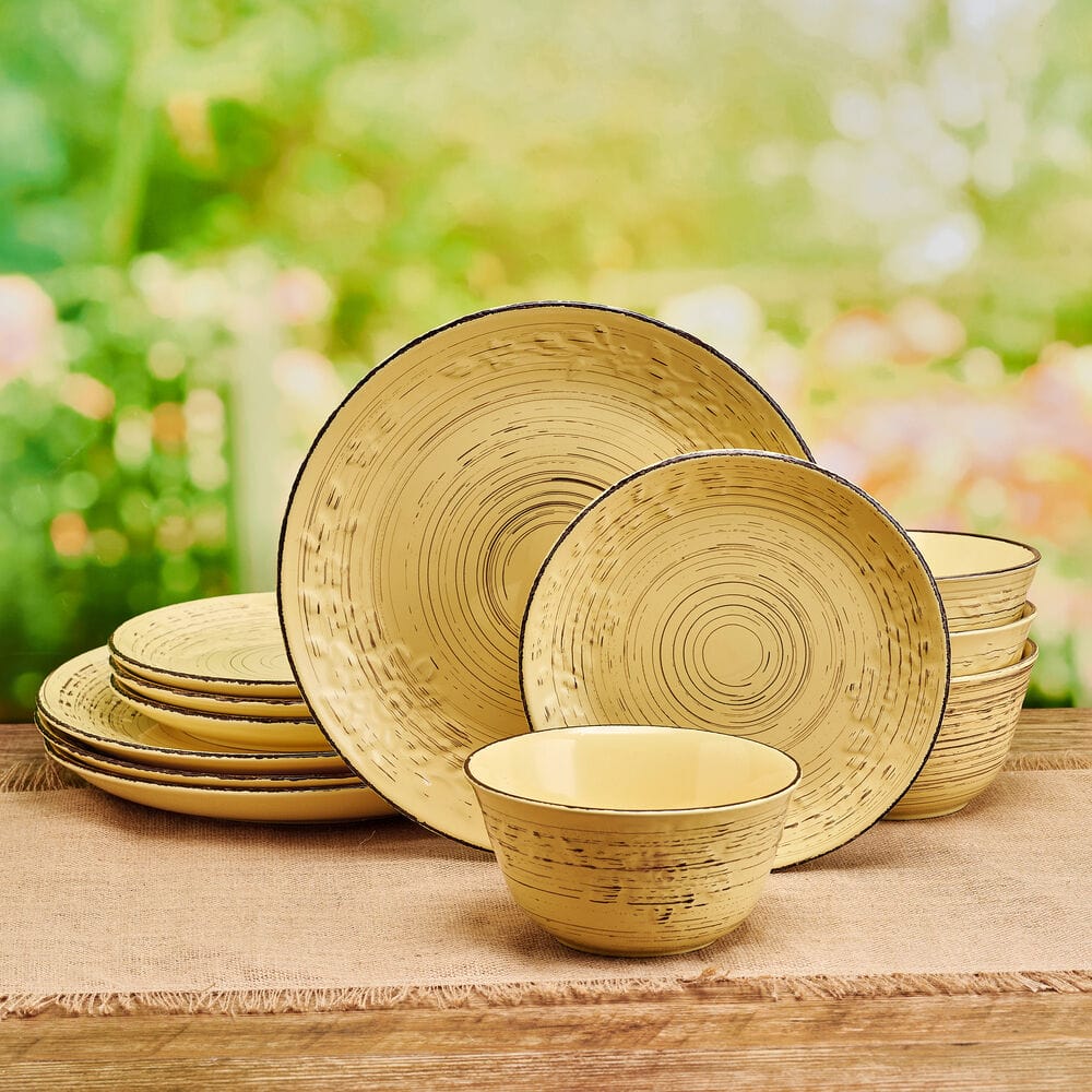 Close-up of floral embossed rim on rustic stoneware dinner plate