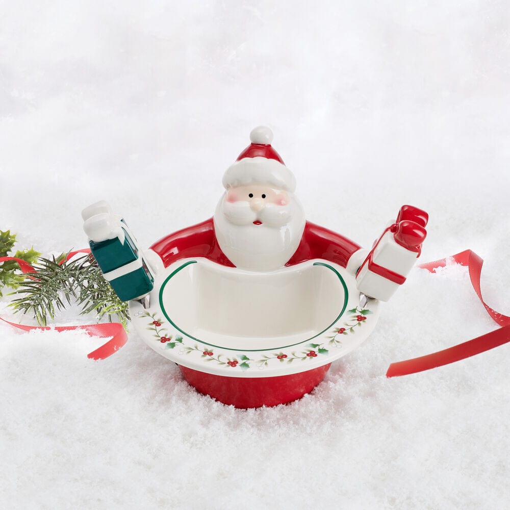 Close-up of Santa dip bowl with gift spreaders for Christmas party