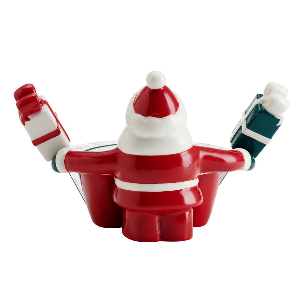 Festive holiday table setup featuring Santa dip bowl and seasonal dishware