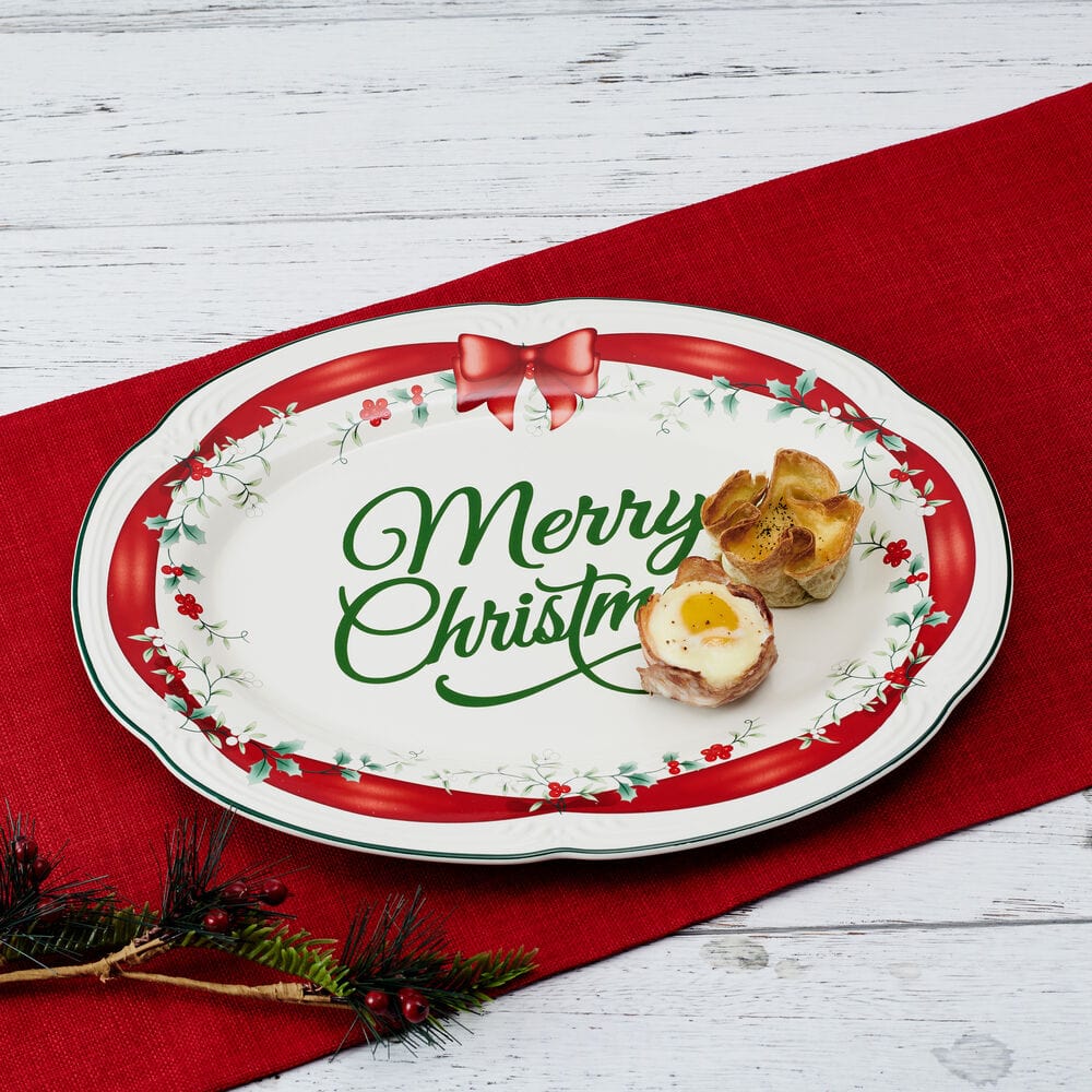 Decorative Christmas stoneware platter with red ribbon design, ideal for holiday serving