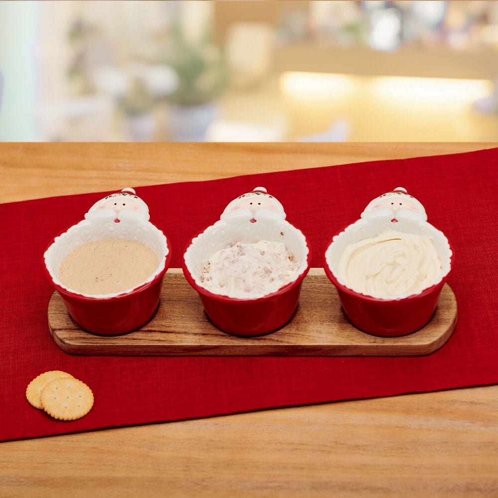 Close-up of Santa face handle on Christmas dip bowl with Winterberry interior detail