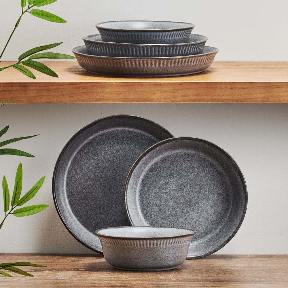 Amara Slate dinner bowl set displayed on a dining table, showcasing unique ceramic bowls for serving.