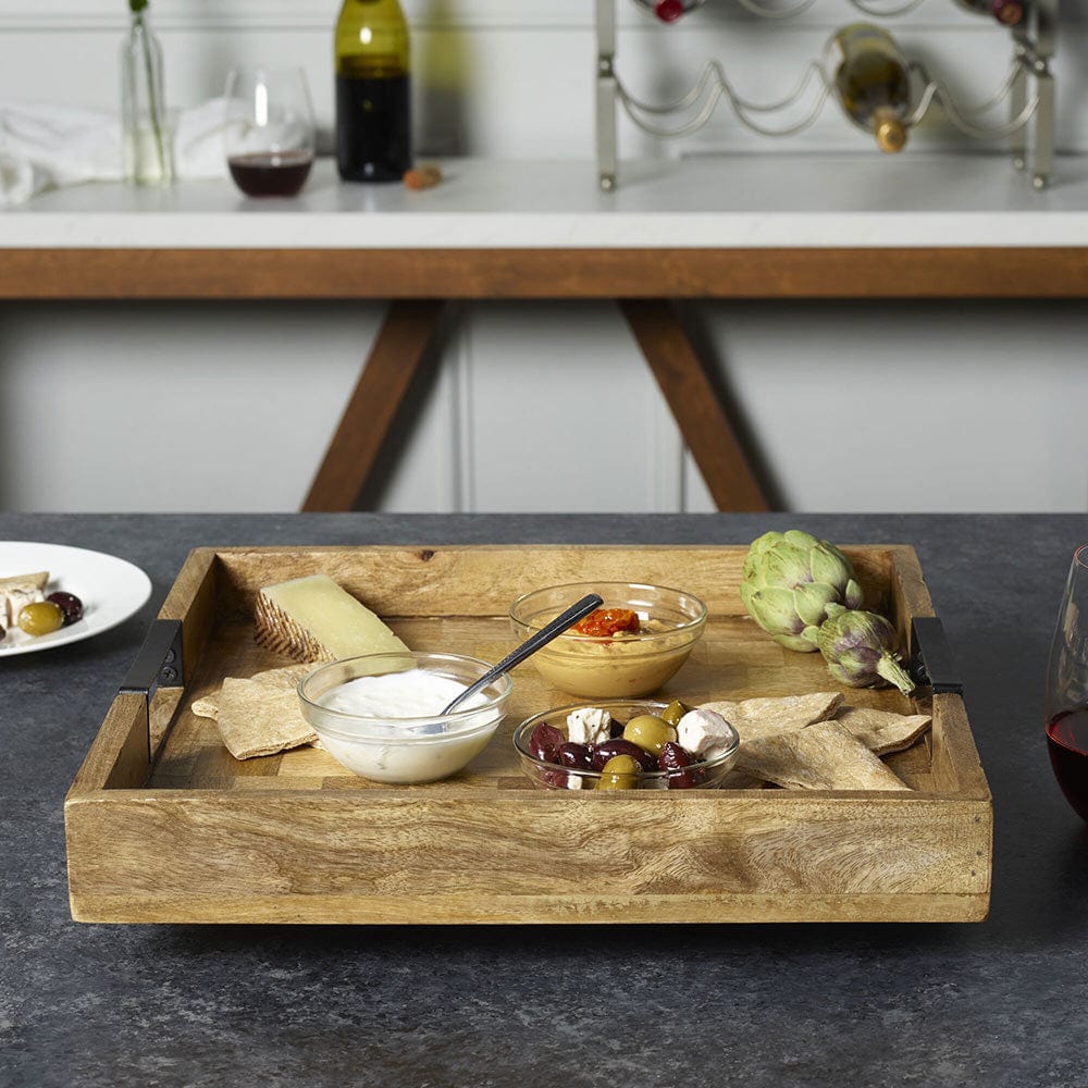 Large rotating serving tray with handles made from mango wood, ideal for entertaining