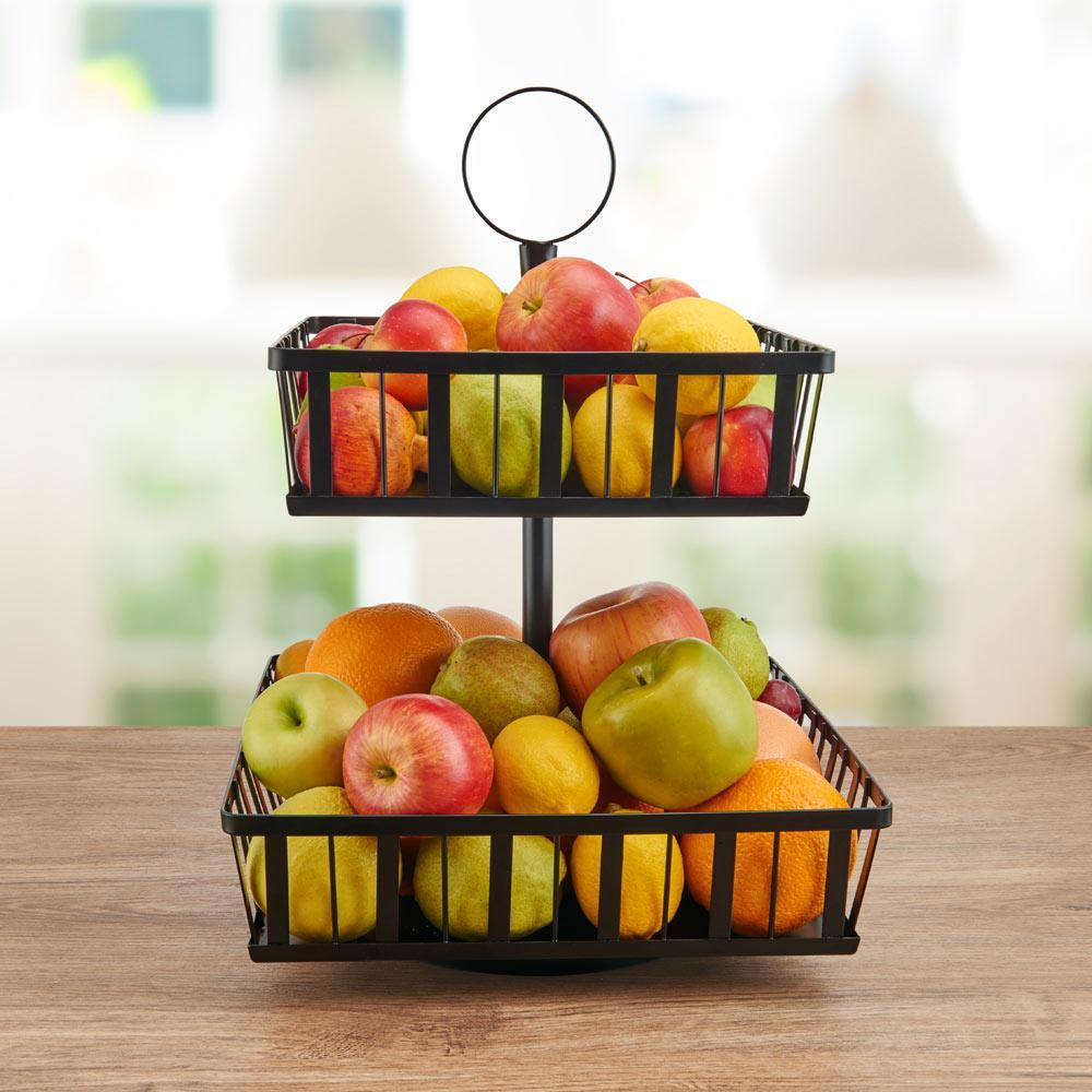 Elegant rotating fruit storage basket showcasing tiered design in kitchen setting.