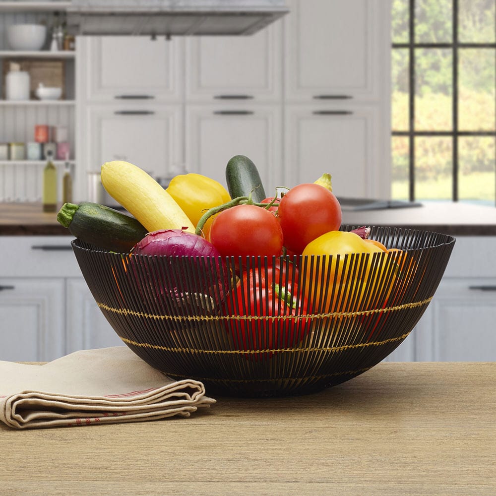 Elegant black wire centerpiece basket showcasing fruits, perfect for dining tables.