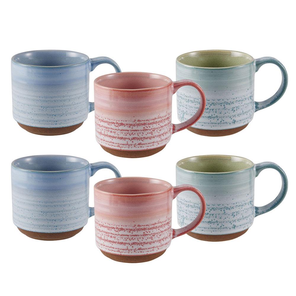Vibrant reactive glazed stoneware mug set displayed on a kitchen countertop, showcasing its unique designs.