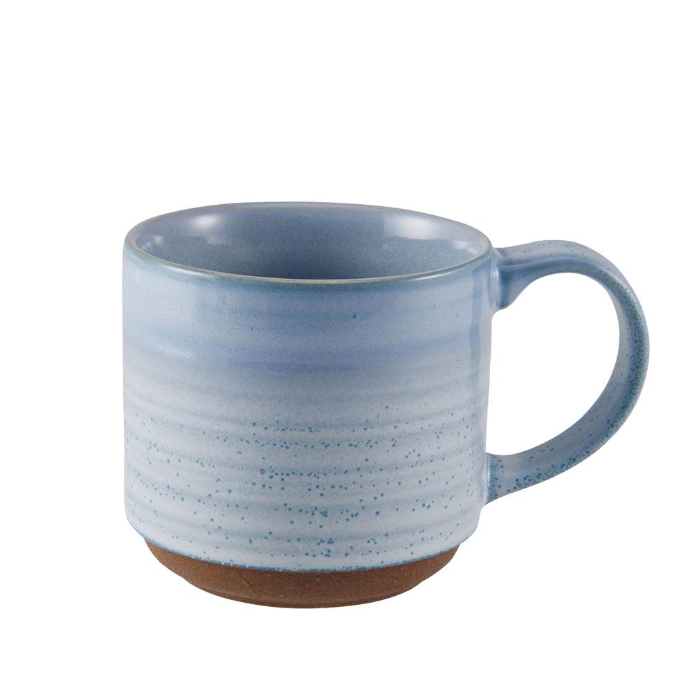 A hand holding a microwave safe reactive mug filled with coffee, demonstrating its practical use in daily life.