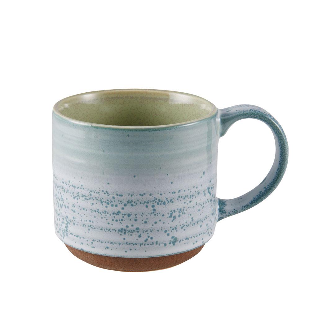 Vibrant reactive glazed stoneware mug set displayed on a kitchen countertop, showcasing its unique designs.
