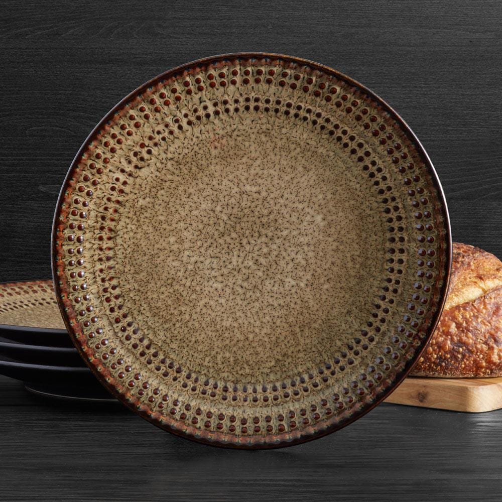 Top view of stoneware dinner plate showcasing reactive glaze in earthy tones