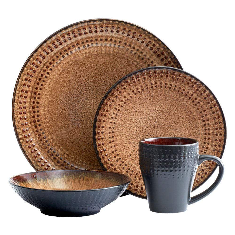 Close-up of stoneware dishes in the dinnerware set, highlighting the intricate reactive glaze patterns and textures.