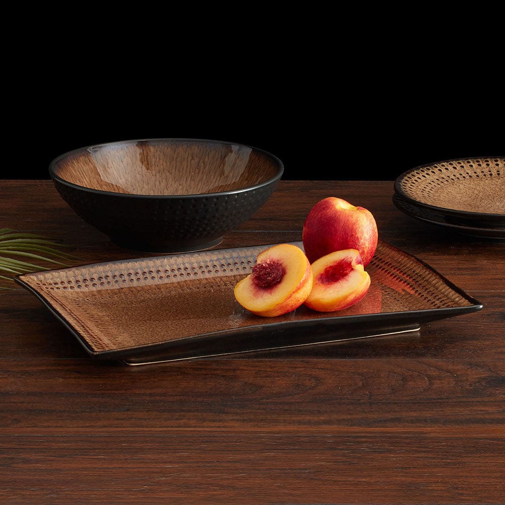 Close-up of the Cambria stoneware platter with a colorful cheese and olive display.