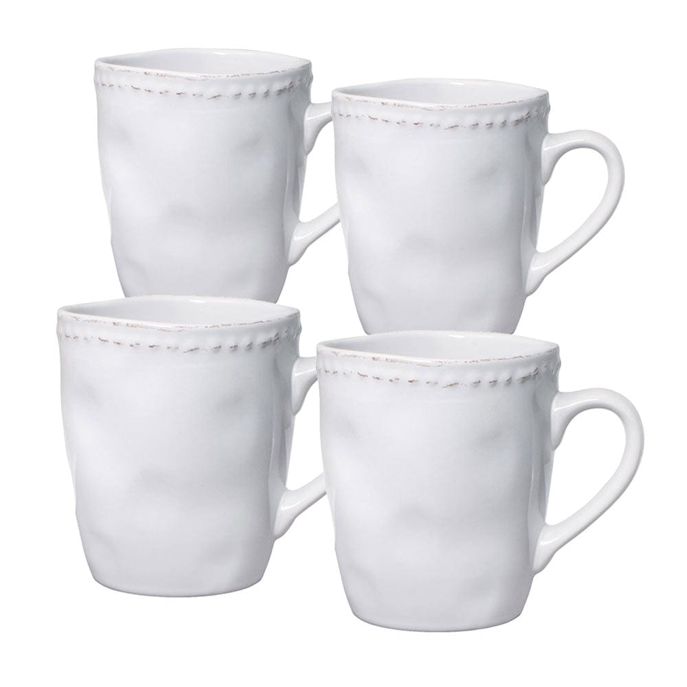 Set of 4 vintage stoneware coffee mugs on kitchen counter