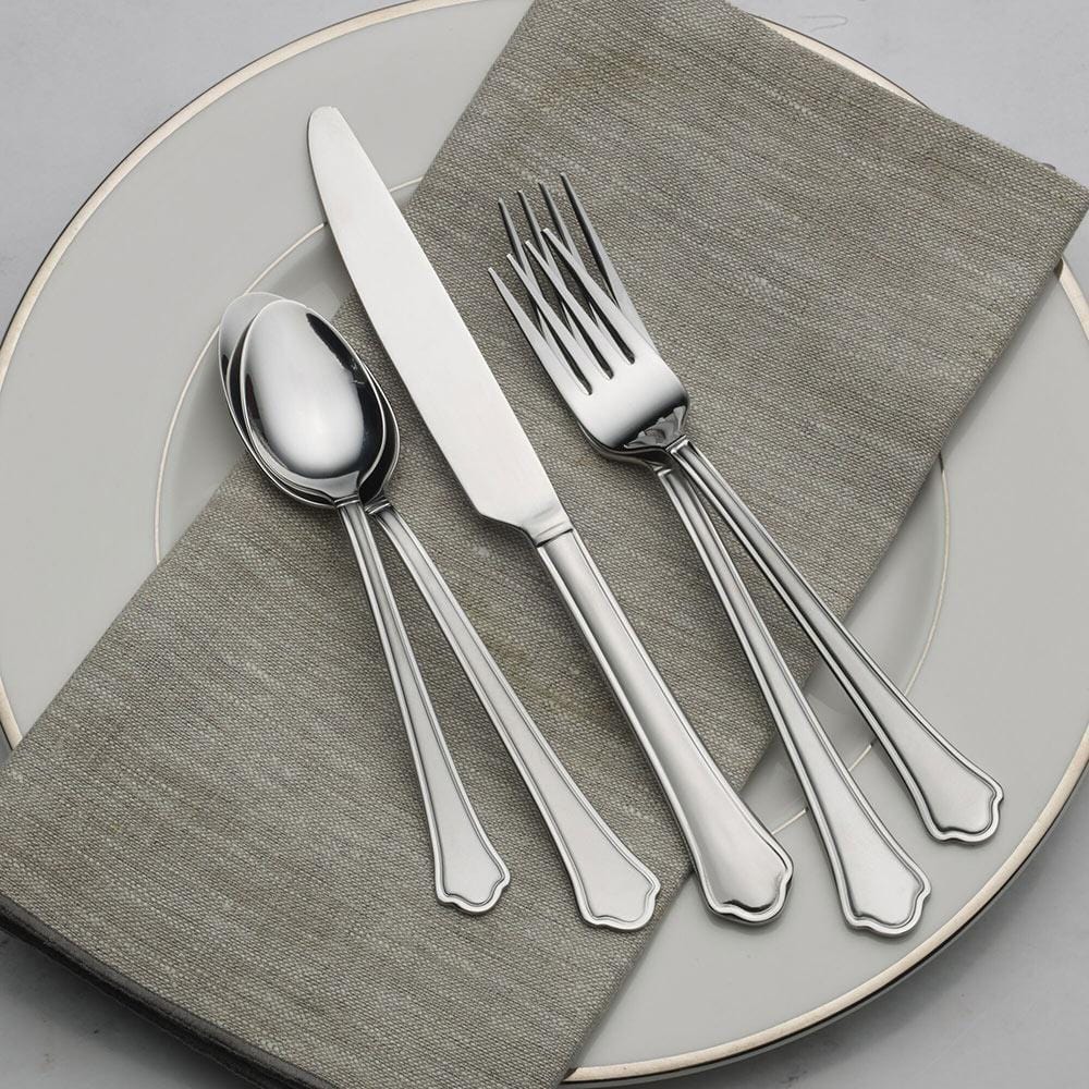 Close-up of the Capri Frost flatware set showcasing the defined handle and scalloped tip.