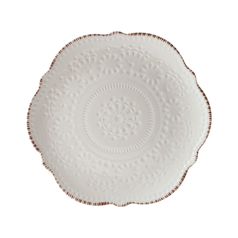 Close-up of the scalloped edges and lace design on Chateau Cream dinnerware