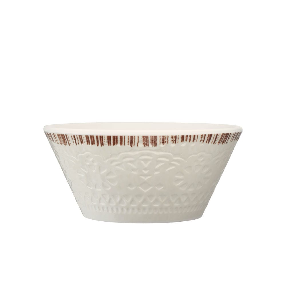 Chateau Cream dinnerware set stacked with outdoor scenery in the background