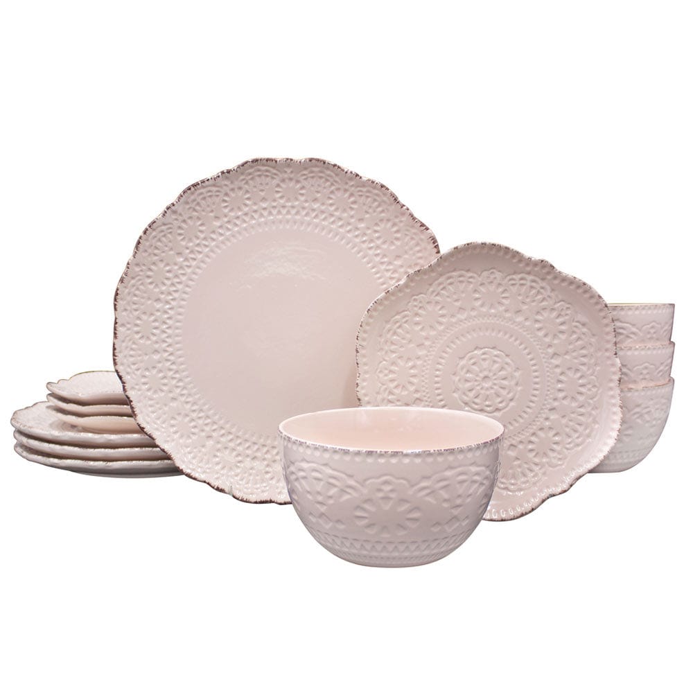 Elegant pink dinnerware set displayed on a modern dining table