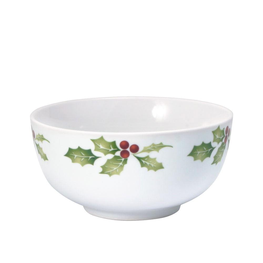 Family gathering with Christmas dinnerware set on a decorated holiday table