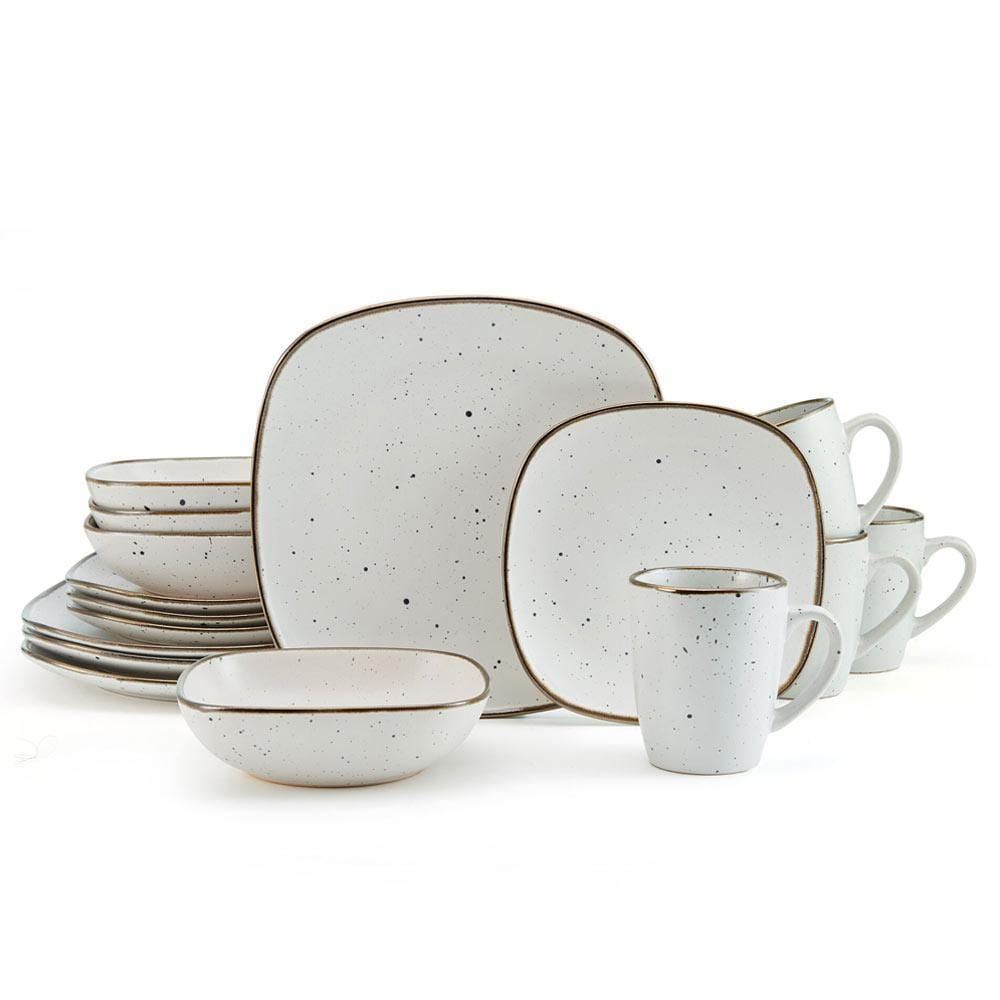 Set of four white stoneware mugs with a sleek design, ideal for coffee or tea