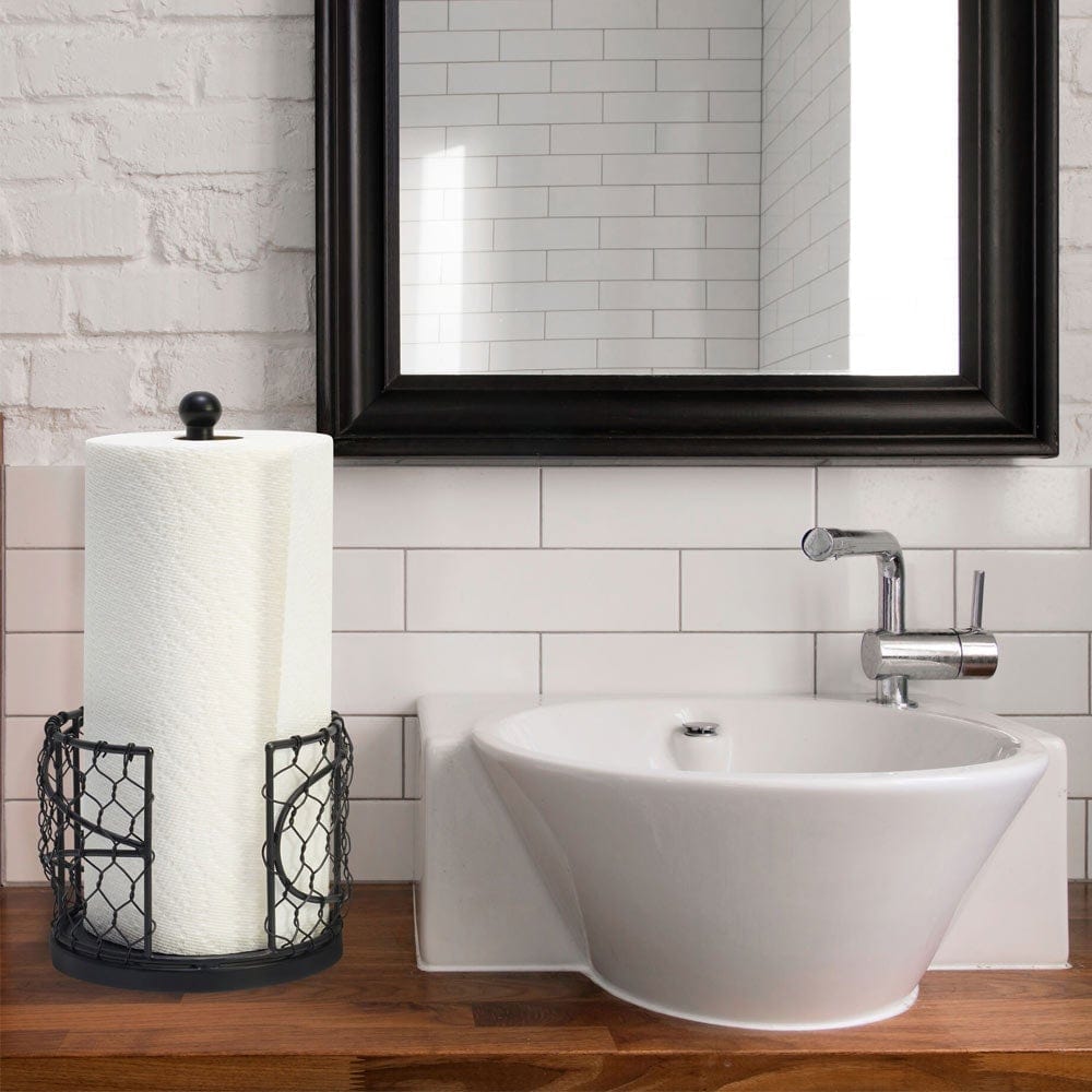 Rustic iron paper towel holder with paper towels installed in a farmhouse kitchen