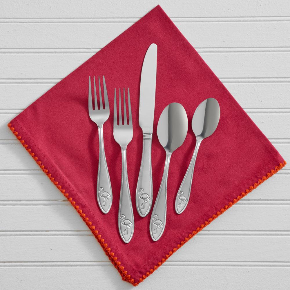 Flatware set arranged neatly on a kitchen counter, showcasing stainless steel finish