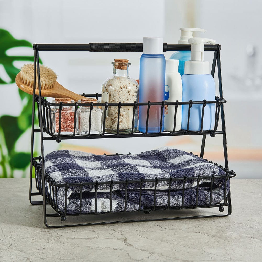Close-up of black metal kitchen basket with open wire design for fruits