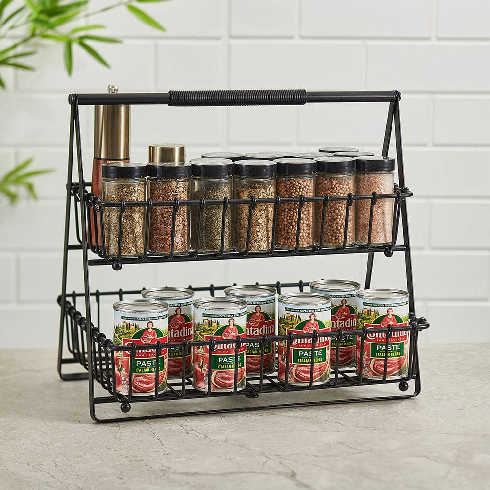 Close-up of black metal kitchen basket with open wire design for fruits