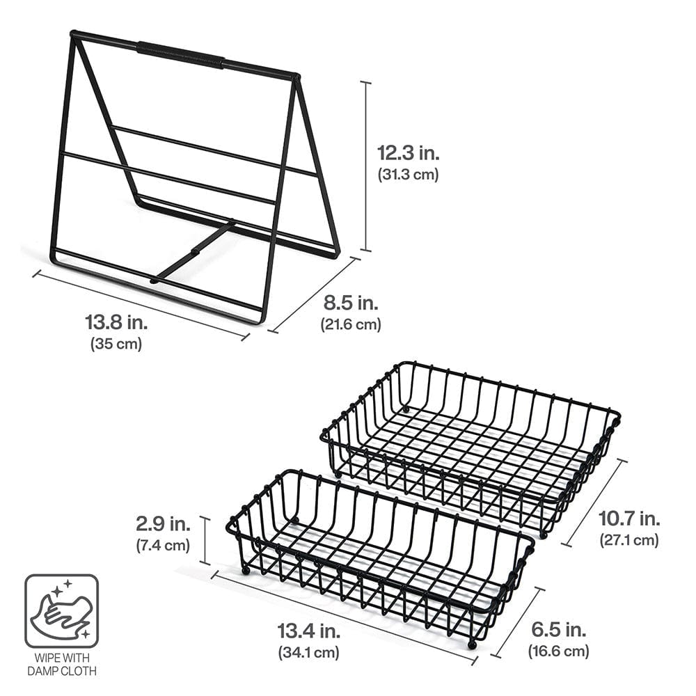 Two-tier black metal storage basket filled with fresh fruits on kitchen counter