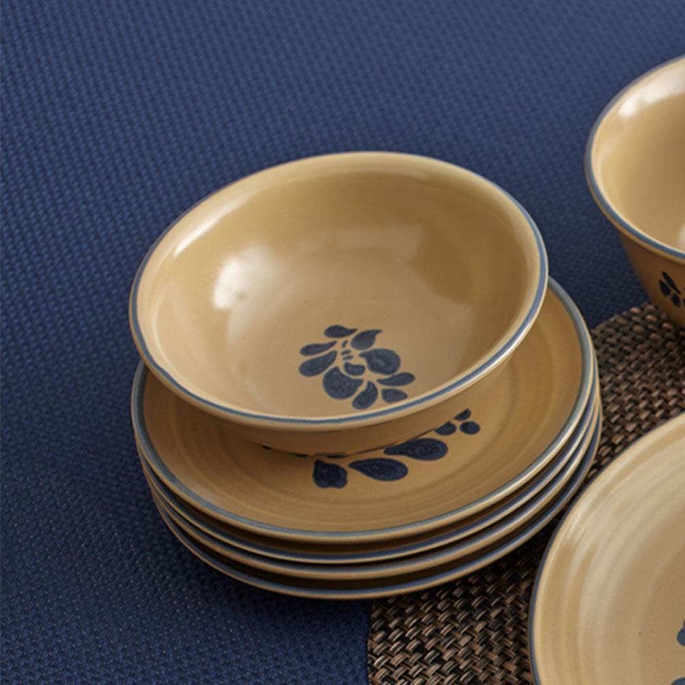 Rustic stoneware bowl set in a kitchen setting, showcasing its use for cereal and soup.